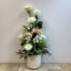 This bouquet has a graceful, garden-inspired shape with soft neutral tones and