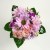 A dreamy petite prom bouquet, featuring soft lavender daisies, charming pink spray
