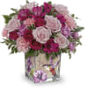 Like a hummingbird flitting around a secret garden, this delightful bouquet of