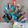 Candy bouquet with assorted chocolate bars in a decorated container
