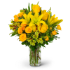 Yellow roses and lilies in a clear glass vase