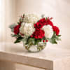Velvet Romance features velvety red roses, lush white hydrangeas, and elegant lilies
