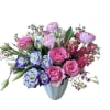Pink roses, pink ranunculus, pink hyacinth, white tulips, pink wax flower and