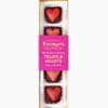 Rectangular box of five red heart-shaped chocolate truffles with pink branded sleeve