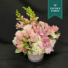 A Fabulous mix of Hydrangea, roses and cymbidium blooms.  Hand Designed