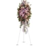 Tall pink and purple floral standing spray on an easel