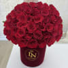 Large bouquet of red roses in a burgundy box