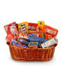 Wicker basket filled with assorted candy bars, snack packs, and a can of nuts.