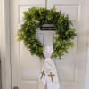 A simple, reverent accent for any season, this permanent botanical wreath features