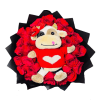 Round arrangement of red roses with a plush cow toy in a red heart sweater