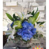Classic blue, white and green tones make up this eye catching bouquet.