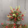 An elevated floral presentation designed to impress. This curated set includes a