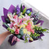A bright, garden-fresh hand-tied bouquet that says "Te quiero" with every petal
