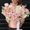 Large blush pink flower arrangement with roses and gerberas in a round hat box