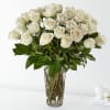 Bouquet of white roses in a clear glass vase
