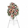 Standing floral spray with pink and white flowers on an easel