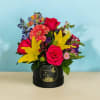 Birthday flower arrangement in a black box with roses and lilies