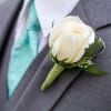 Elegant boutonniere to elevate any special occasion.  Available in any color.