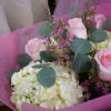 Pink roses and white hydrangeas in pink wrapping