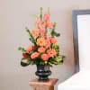 A vibrant orange traditional arrangement is a sweet way to express the