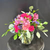 Vivid pink carnations and soft blush blooms mingle with pink alstroemeria and
