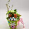 A cheerful and playful Easter treat, this vibrant green basket is filled