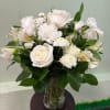 A timeless arrangement featuring creamy white roses, soft carnations, and delicate alstroemeria