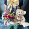 Birthday flower gift with a teddy bear and pink roses in a box