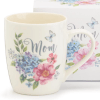 Cream ceramic mug with pastel flowers, butterflies, and the word Mom on the front
