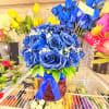 Beautiful Vase of Bloomed blue roses great for that special male person