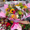 A huge bouquet made up of a variety of different flowers and