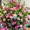 A beautiful large mix of lily's and mini carnations filled with greenery