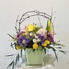 Elevate your Easter celebrations with the Pastel Easter Arrangement by Westford Florist