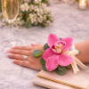 Orchid Wrist Corsage &ndash; $65

Elegant wrist corsage designed with a fresh orchid