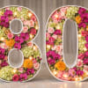 Celebrate eight decades of life with a breathtaking, custom-designed "80" standing sculpture.