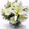 Soft, graceful, and effortlessly elegant, this refined arrangement features a stunning white