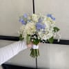 A compact, hand-tied mini prom bouquet designed to complement formal wear. Perfect