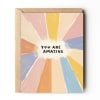 Greeting card with colorful rays and the words 
