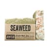 Seaweed-scented handmade bar soap with kraft paper label and exfoliating texture