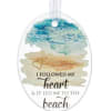 Oval beach-themed hanging ornament with watercolor ocean art and heart quote text