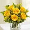 A bright and cheerful floral arrangement featuring vibrant yellow roses accented with