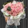 A dense heart of soft pink roses creates an unmistakable romantic focal