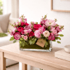 Pink and magenta flower arrangement in a glass vase
