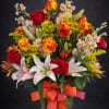  A lovely arrangement filled with colorful roses, calalilies, stock and filler.