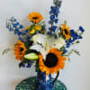 A bright and cheerful arrangement to spread some cheer to those needing