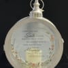 Round memorial lantern with a printed sympathy message and floral accents