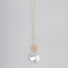 Gold chain necklace with engraved disc and clear heart-shaped crystal pendant