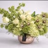 A Filed of green inspired blossoms with roses that floats above a