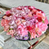 This low centerpiece arrangement is full of stunning Roses, Garden Roses, Cymbidium