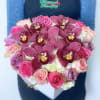 Heart-shaped box of pink roses and burgundy orchids